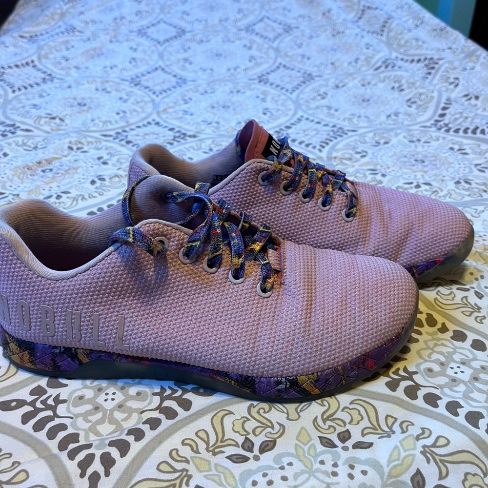 Light purple NoBull shoes. Multi-purple pattern soles.